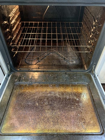 reviewer before photo showing the inside of a crusty oven
