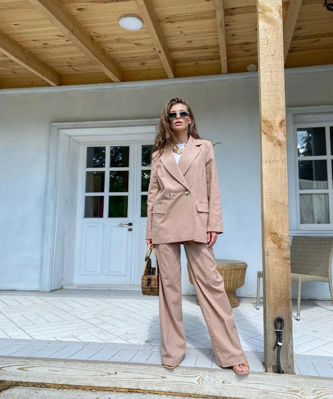 another model poses in beige