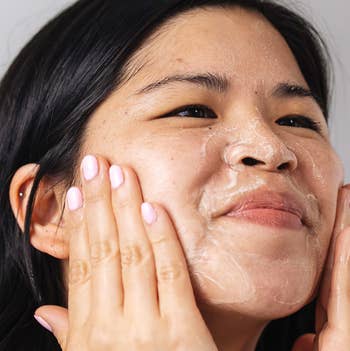 a model using the face wash