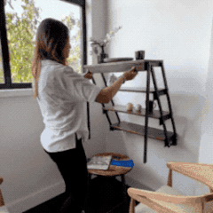 gif of the model pulling the table down from the wall