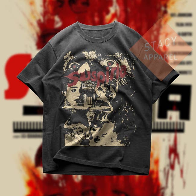 Graphic tee featuring abstract artwork, displayed on a stylized background for STACY APPAREL