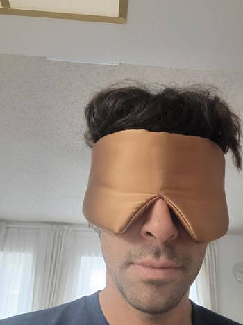 Person wearing a plush slumber disguise indoors