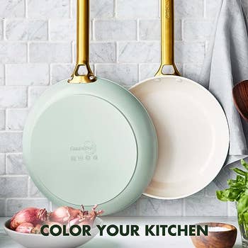 A mint green pan and a white pan