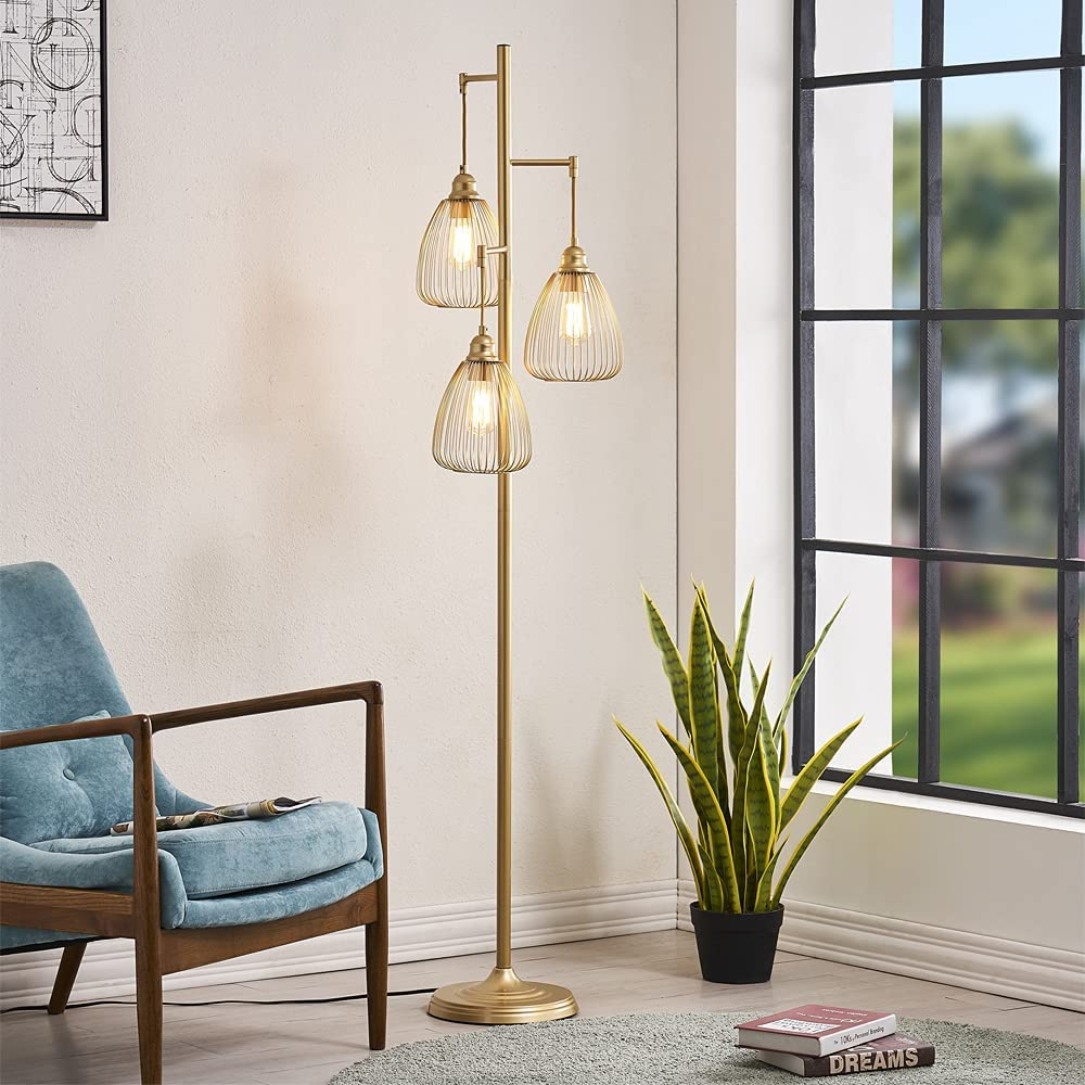 the gold-tone lamp lit up in a living room