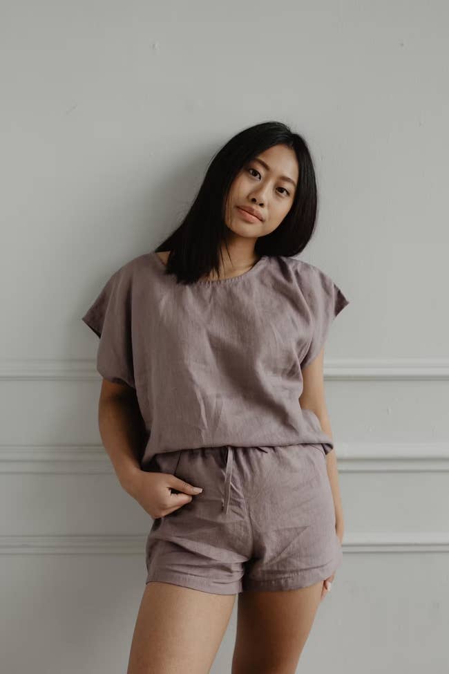 model in a linen shorts and short sleeve pj set