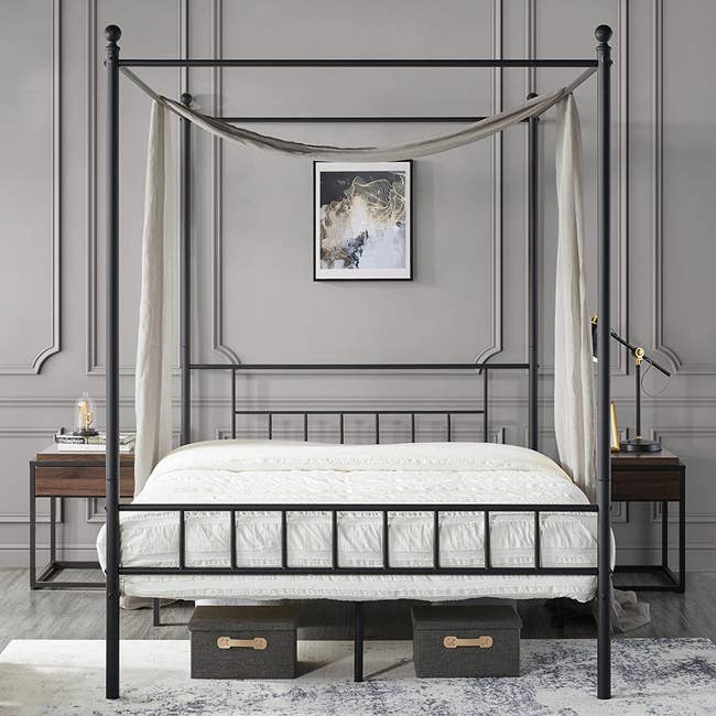 black four-canopy bed
