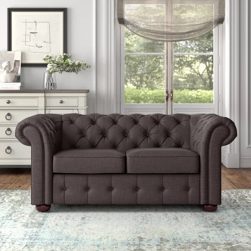 a brownish chesterfield loveseat