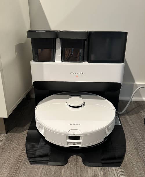 the white robot vacuum in the dock