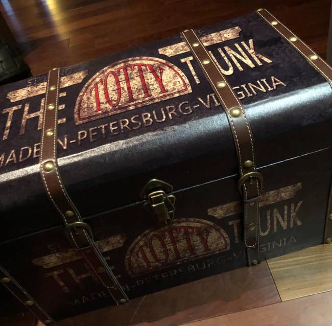 Vintage-style trunk with bold lettering, likely a replica or themed merchandise
