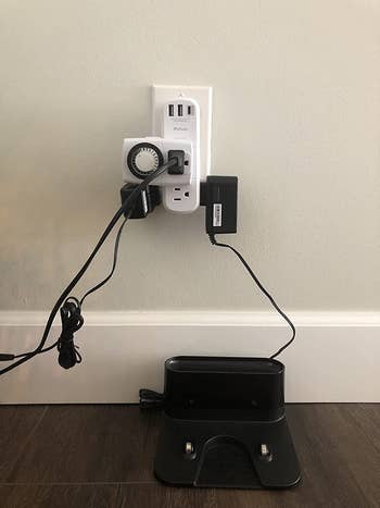 before photo of a reviewer's cluttered outlet with multiple items plugged into an outlet
