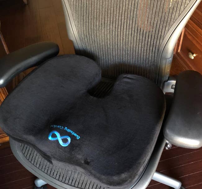 Reviewer's seat cushion on an office chair