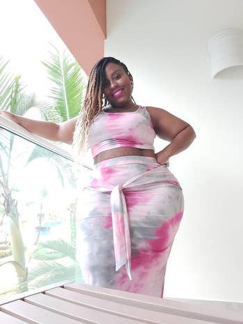 reviewer wearing the tie-dye dress in pink and grey