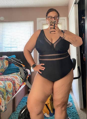 reviewer wearing the swimsuit in black