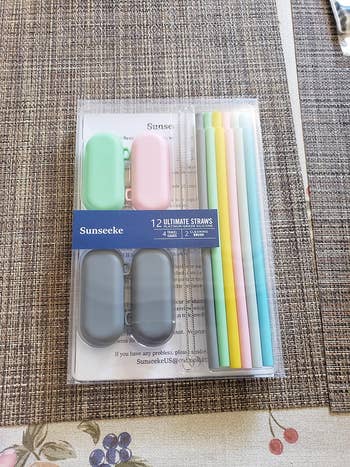 a reviewer photo of the set of straws with matching carrying case