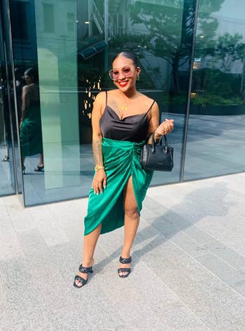 Reviewer in green version of the midi skirt 