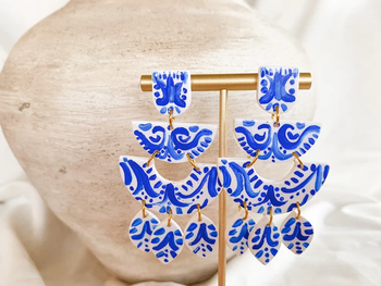 white clay tiered drop earrings with blue painted design