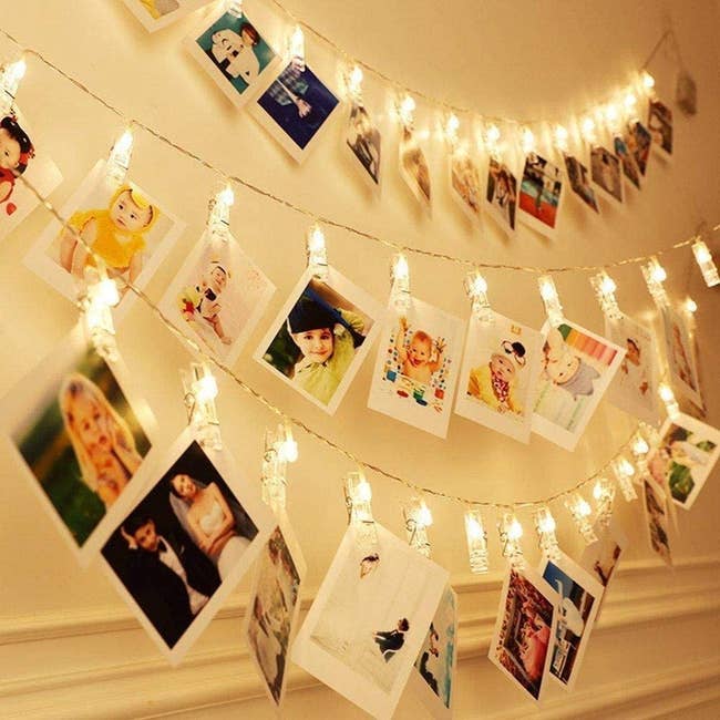 string lights with polaroid pics clipped onto them