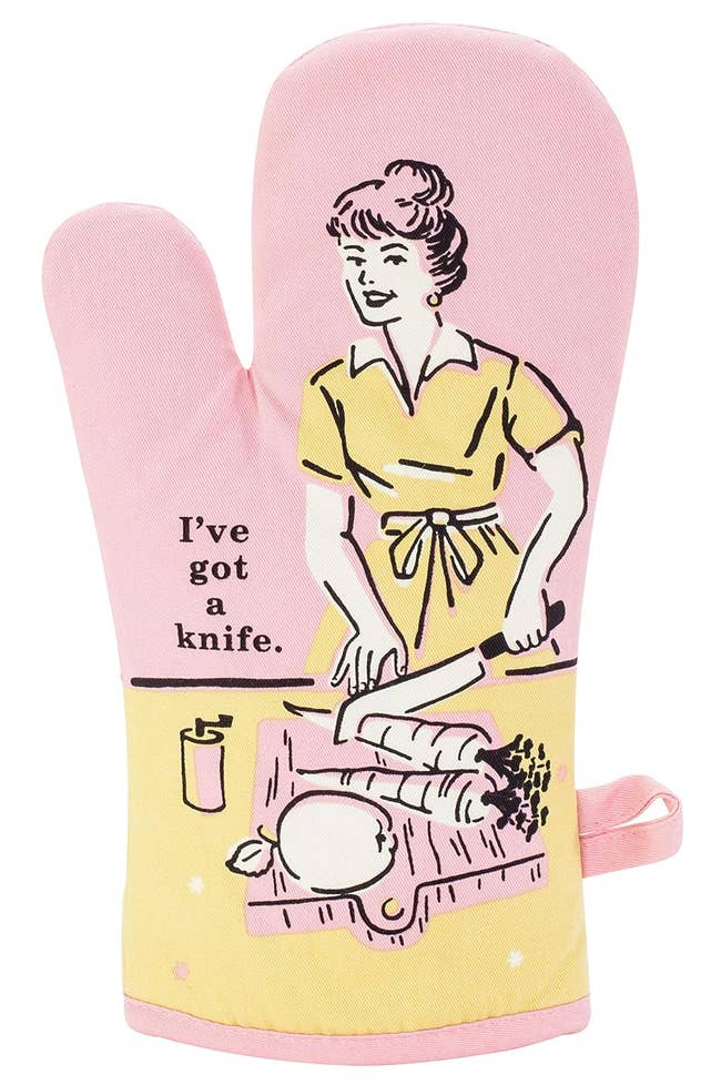 yellow and pink oven mitt featuring illustration of woman chopping vegetables with text