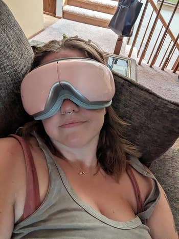 Reviewer wearing oculus  massager