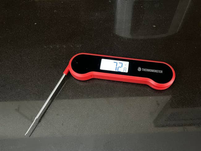 Digital nutrient   thermometer displaying 72.4 degrees, with a foldable metallic  probe and sleek design, suitable for room  use