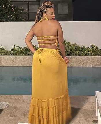back of reviewer wearing the yellow dress