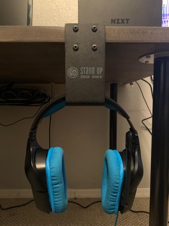 reviewer photo of their headphones hanging on the hook