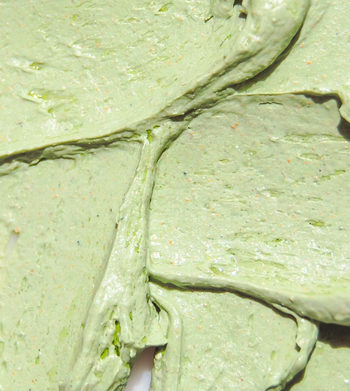 A close-up of the green texture of the Earth Mask