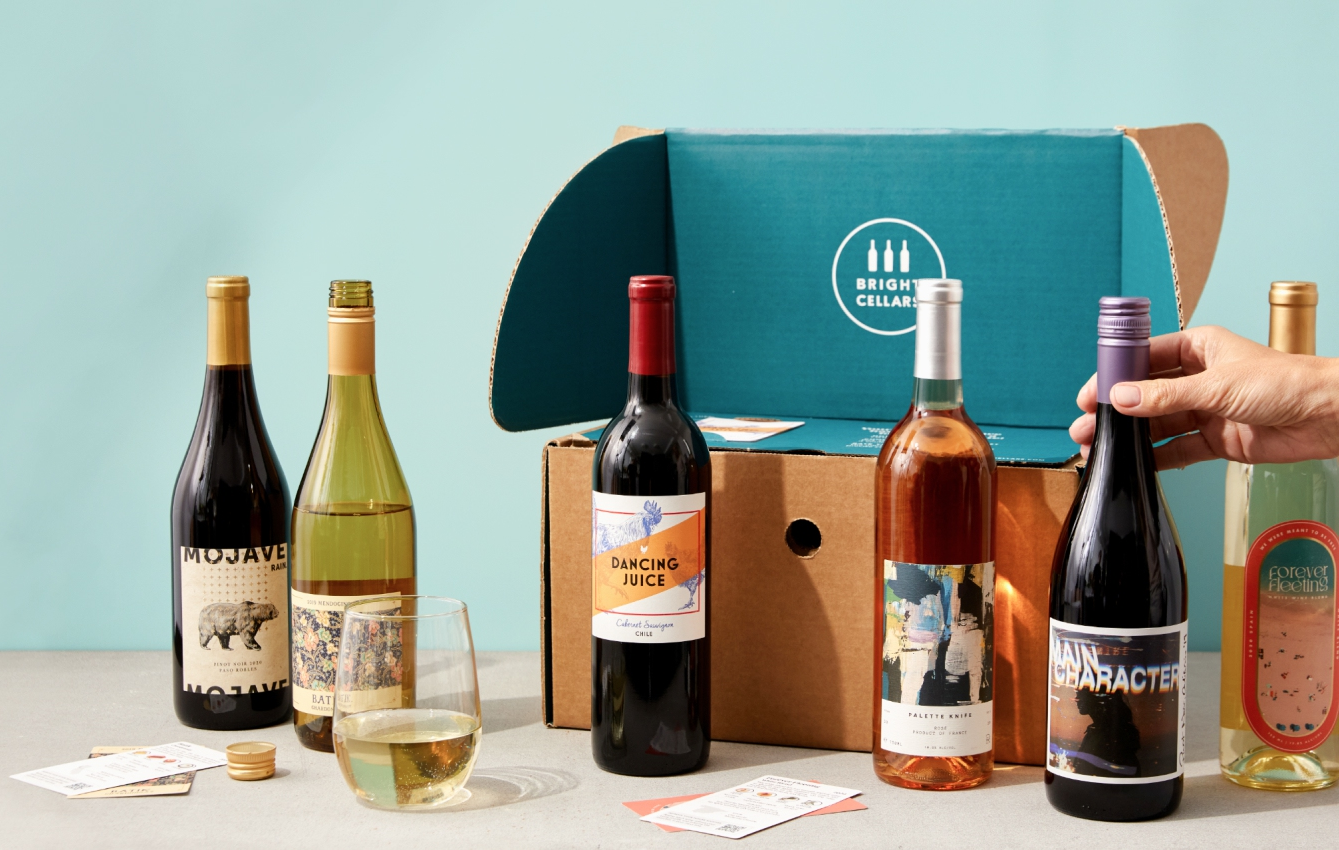 six bottles of wine in front of a box