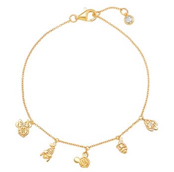 a thin gold charm bracelet with minnie goofy mickey donald and pluto on it