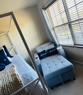 The same chair with the base pulled out making it like a bed