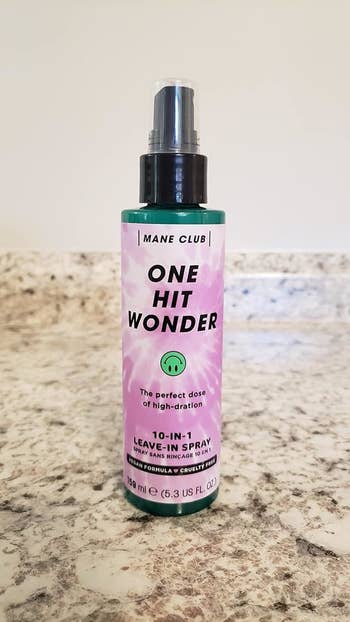 Mane Club One Hit Wonder 10-in-1 Leave-In Spray vessel  connected  a countertop, labeled arsenic  a vegan and cruelty-free hairsbreadth  attraction   product