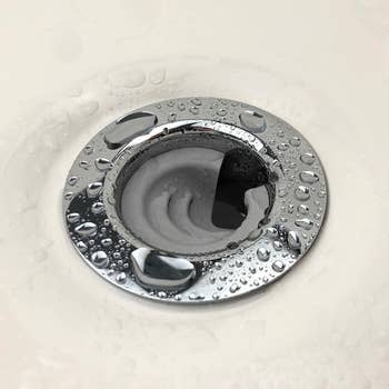 A close-up of a sink drain with the DrainFunnel in it