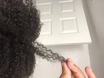 reviewer with 4c hair showing bouncy, defined coils