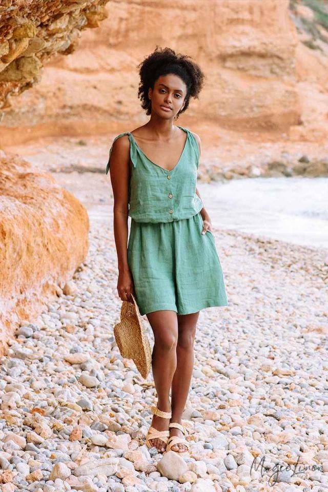 model wearing the turquoise romper