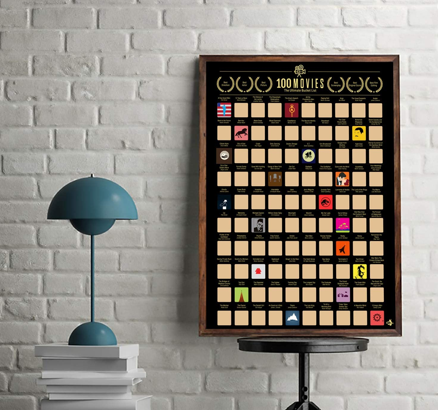 The 100 movies scratch-off poster resting against a wall with some boxes scratched off