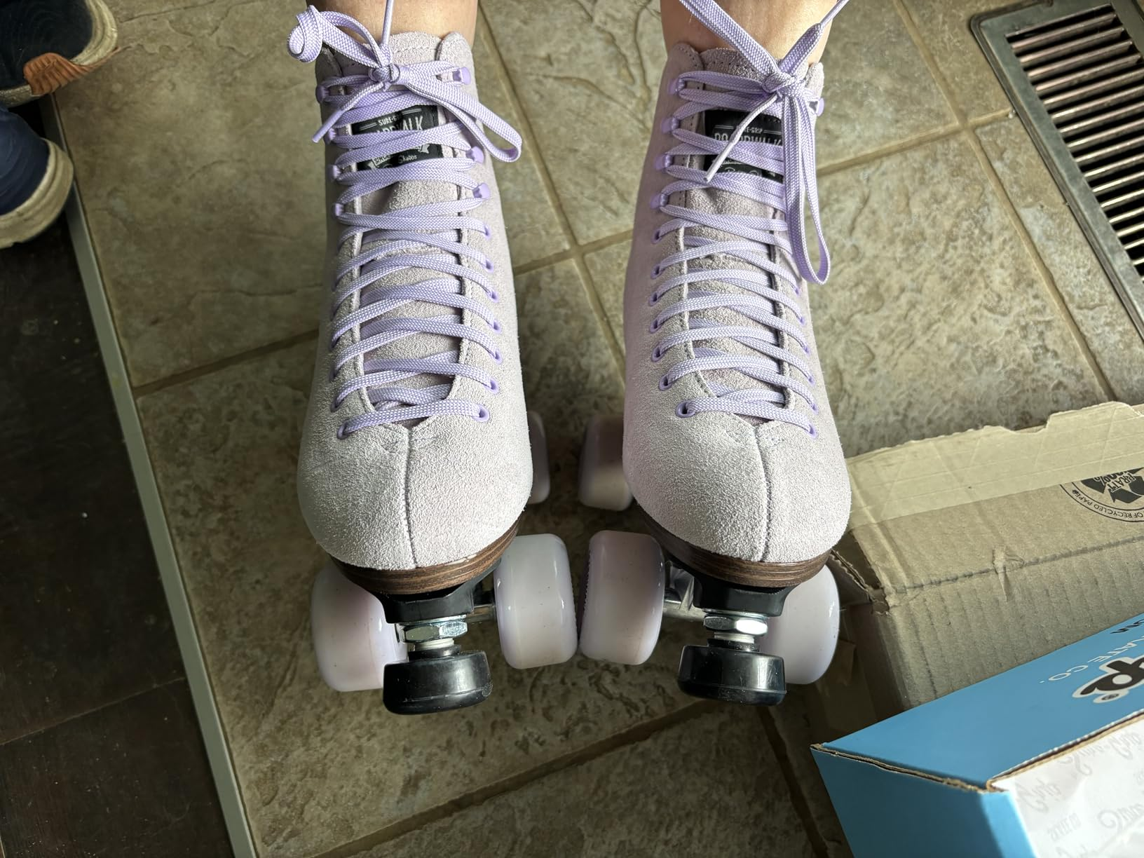 Pair of roller skates with airy  purple laces