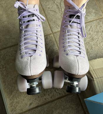 Pair of roller skates with airy purple laces
