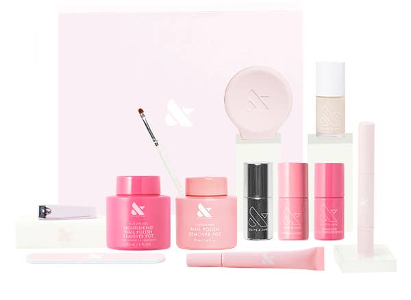Assorted skincare and quality products are displayed, including jars, bottles, and a brush, suitable for a quality buying article