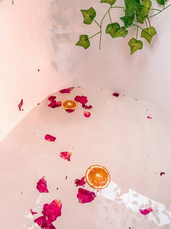 a bath with roses and orange slices