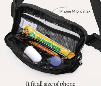 The open bag to show what it can fit, including an iPhone 14 pro max