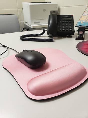 reviewer photo of pink mouse pad with wrist support