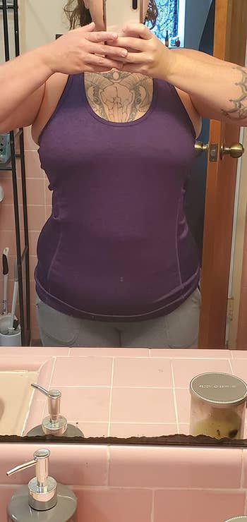 A reviewer wearing the tank in purple