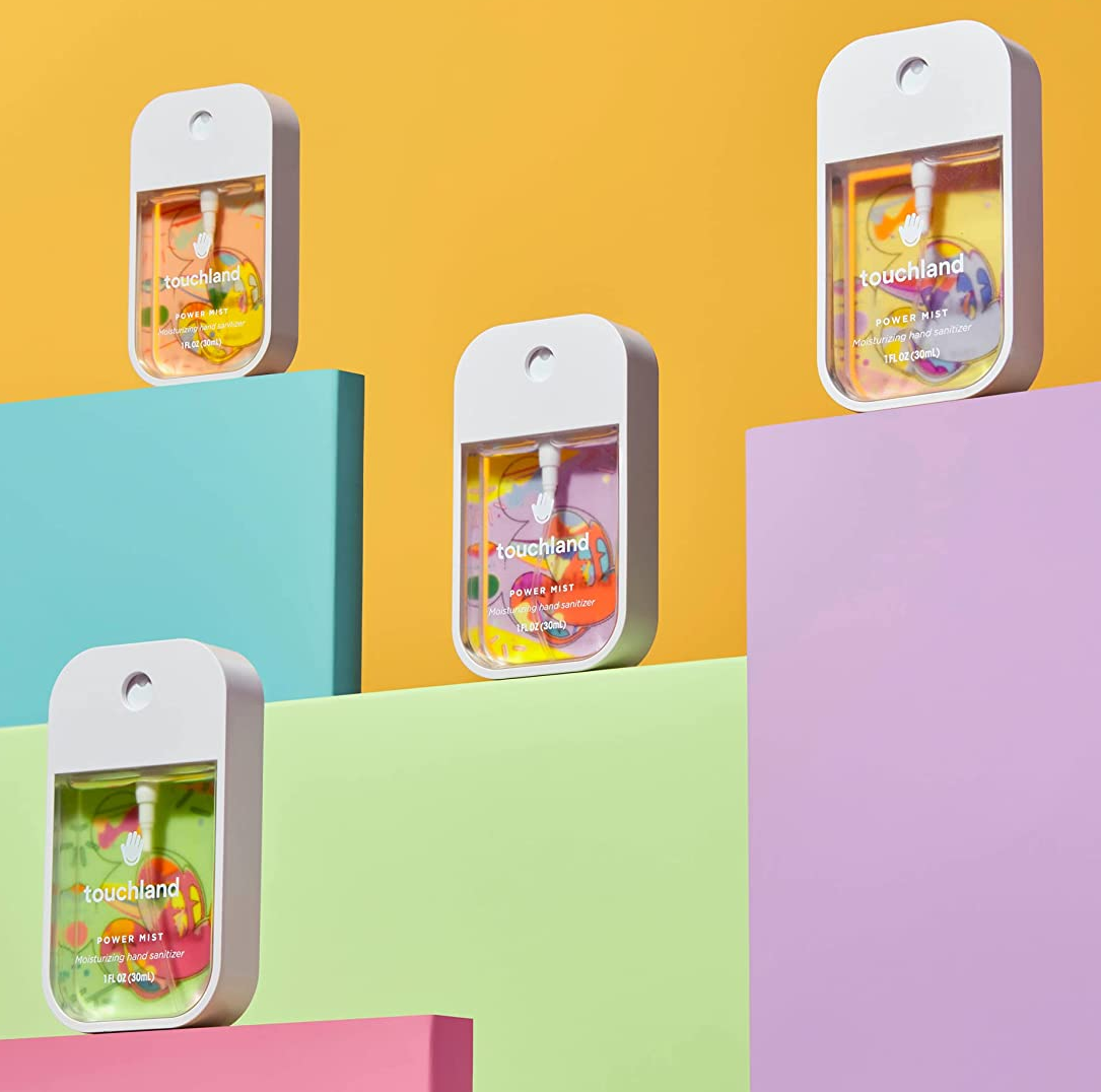 the four-pack of disney-themed hand sanitizers on a colorful background