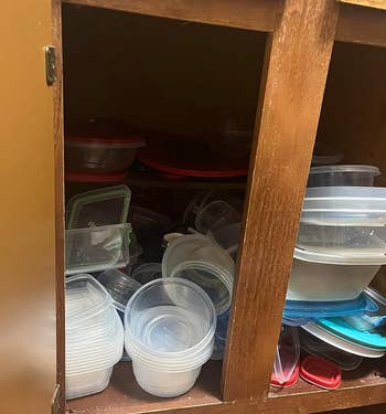 reviewer's cabinet with tupperware lids everywhere