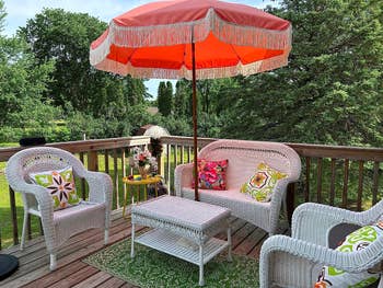 Reviewer's coral pink umbrella on the patio