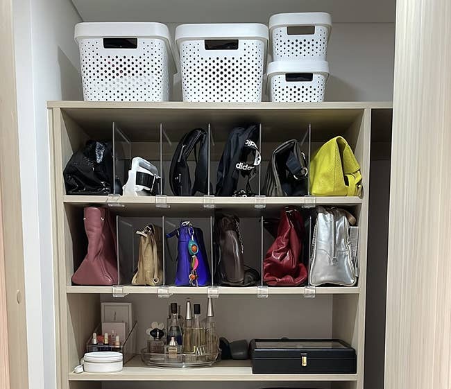 a reviewer photo of the clear shelf dividers used in a closet for organizing purses