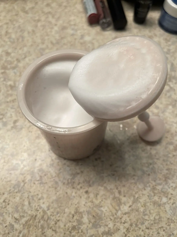 Inside of Marshmallow Whip Maker with foamy cleanser inside