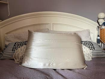 Silk pillowcase connected  a made furniture  with decorative pillows and a achromatic  headboard, suggesting chamber  décor oregon  bedding shopping