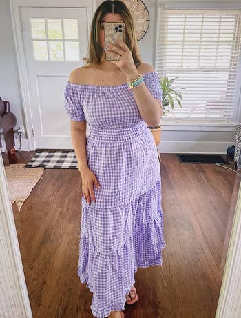reviewer wearing the dress in purple