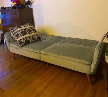 reviewer photo of unfolded green futon bed